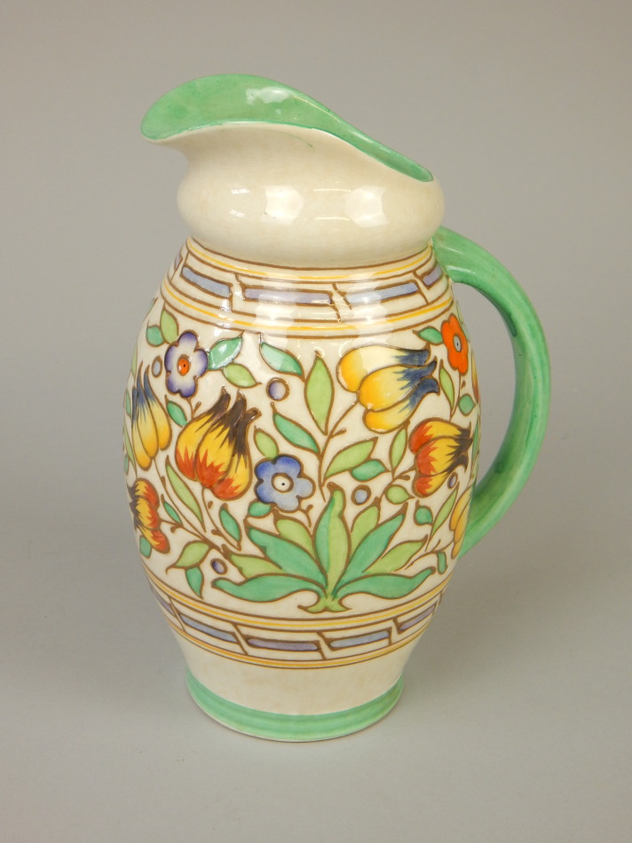 Appraisal: A Bursley Art Deco style jug with tube lined decoration