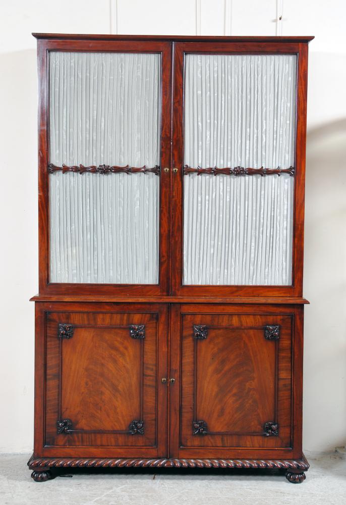 Appraisal: A LATE GEORGIAN MAHOGANY BOOKCASE the moulded cornice over two