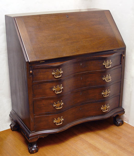 Appraisal: MAHOGANY CHIPPENDALE STYLE SECRETARY DESK Serpentine front of four drawers