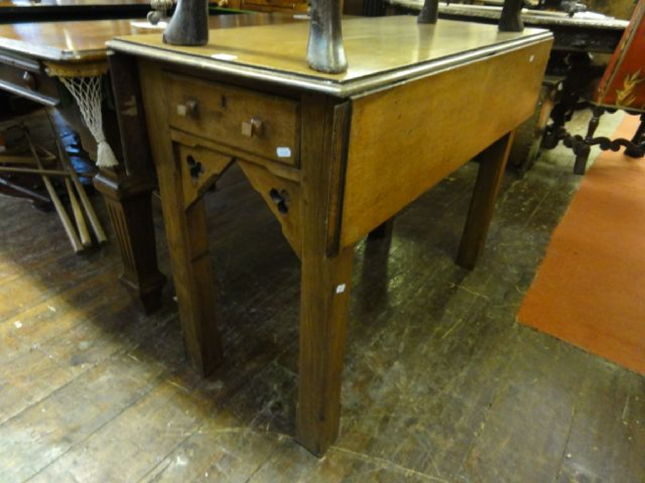 Appraisal: A medium to light oak ecclesiastical Pembroke type table with