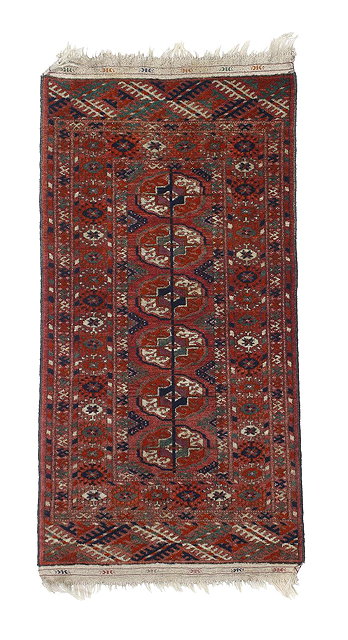 Appraisal: A Turkoman red ground matwith geometric and medallion design cm