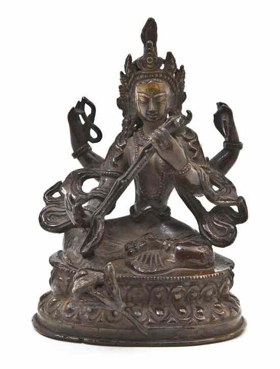 Appraisal: A Southeast Asian Bronze Figure of a Deity the figure