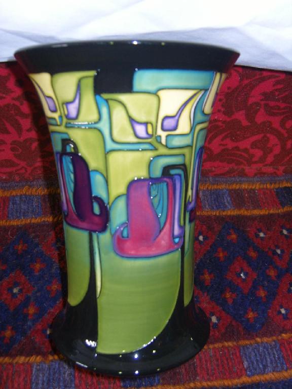 Appraisal: A Moorcroft vase with flared neck and painted Art Nouveau