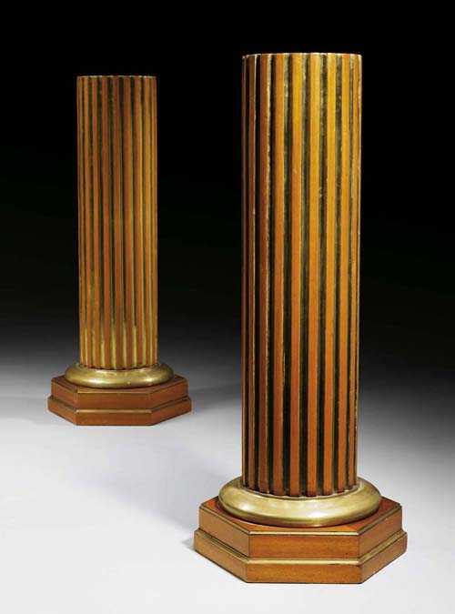 Appraisal: PAIR OF MAHOGANY AND BRASS COLUMN STANDS Empire style Russia