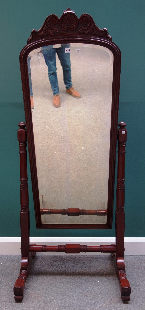 Appraisal: A Victorian mahogany cheval mirror on turned supports cm wide