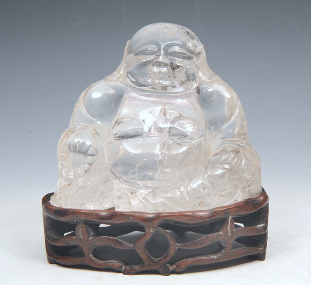 Appraisal: AN ORIENTAL ROCK CRYSTAL CARVING of a seated bhudda on