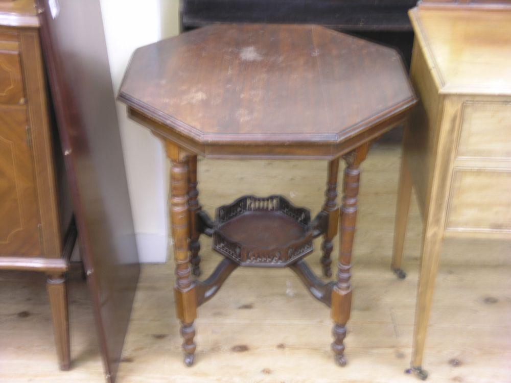 Appraisal: An Edwardian octagoanl walnut occasional table on turned legs with