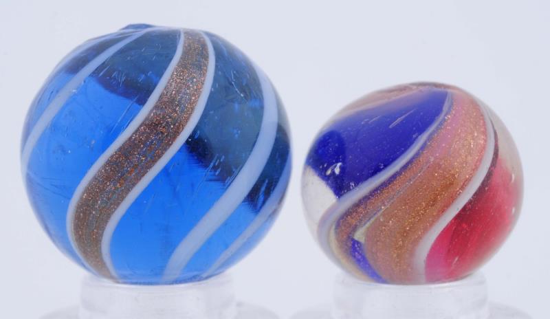 Appraisal: Lot Of Lutz Marbles The smaller is a red and