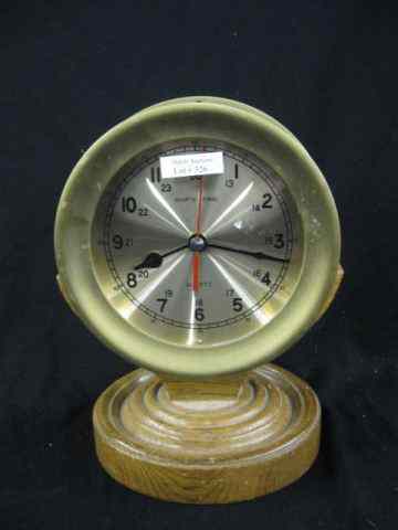 Appraisal: Ship's Clock brass on wooden pedestalholder quartz '' diameter