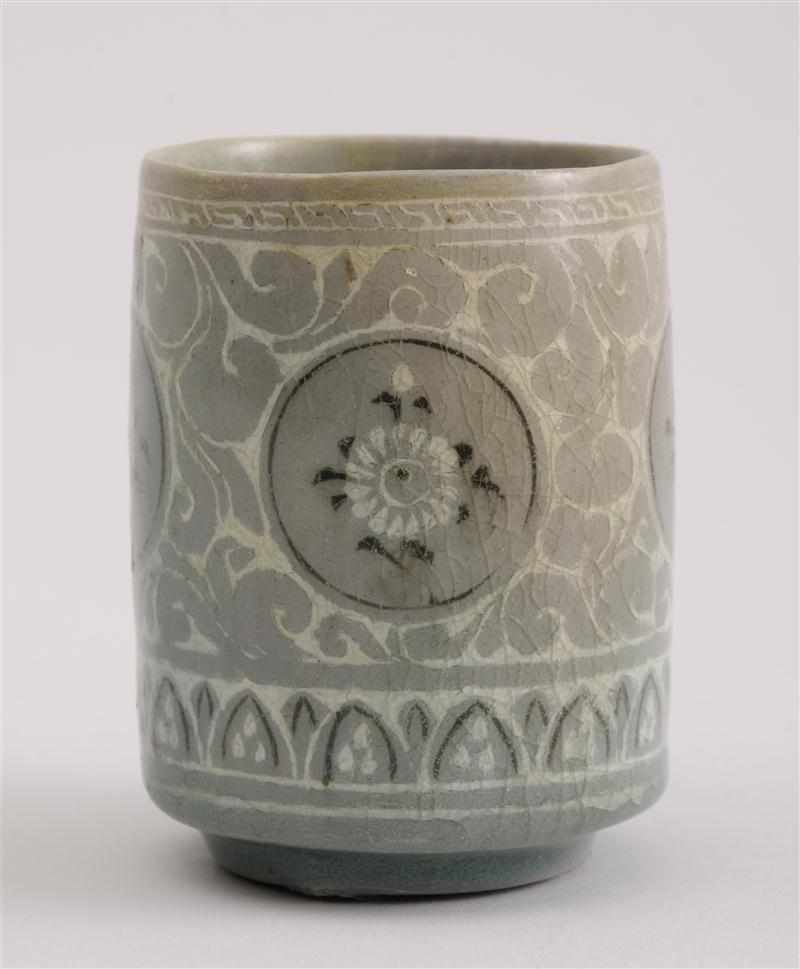 Appraisal: KOREAN KORYO STYLE CELADON CYLINDRICAL CUP With four floral roundels