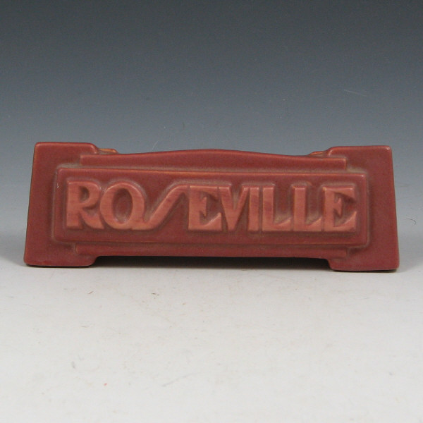 Appraisal: Roseville dealer sign in deco motif finished in mauve or