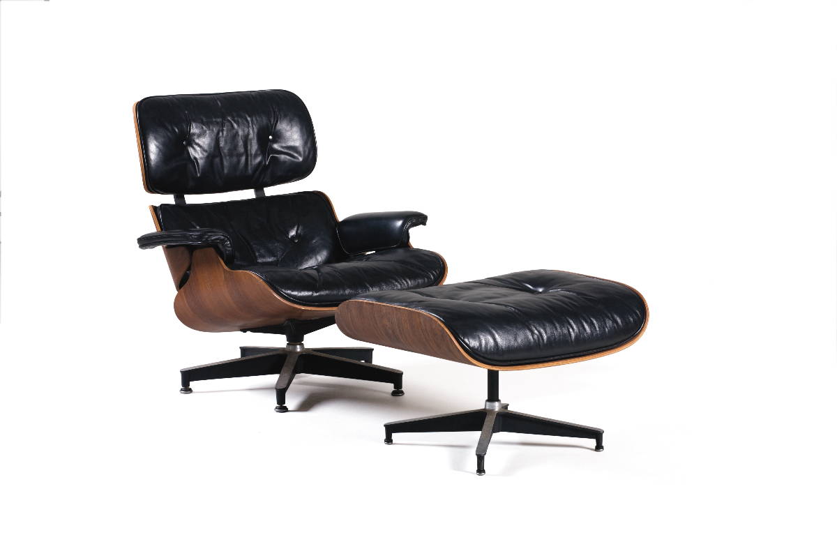 Appraisal: CHARLES AND RAY EAMES BLACK LEATHER- UPHOLSTERED LOUNGE CHAIR AND