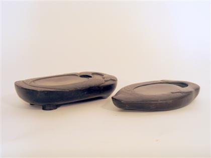 Appraisal: Two Chinese Duan inkstones th century Both of oval form