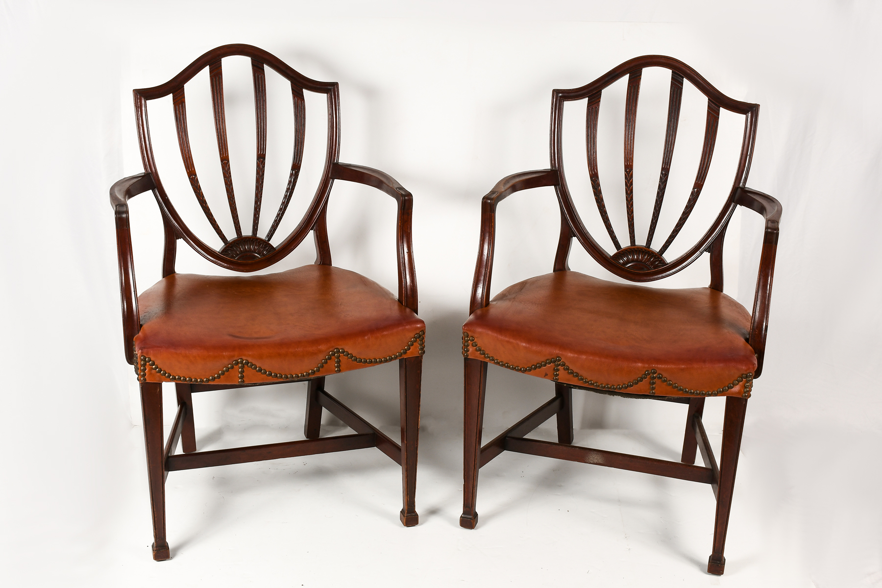 Appraisal: PAIR OF HEPPLEWHITE STYLE SHIELD-BACK ARMCHAIRS Pair of Hepplewhite style