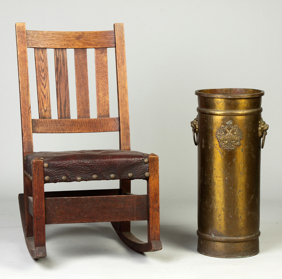 Appraisal: Arts Crafts Oak Rocking Chair C Decorated with two lions