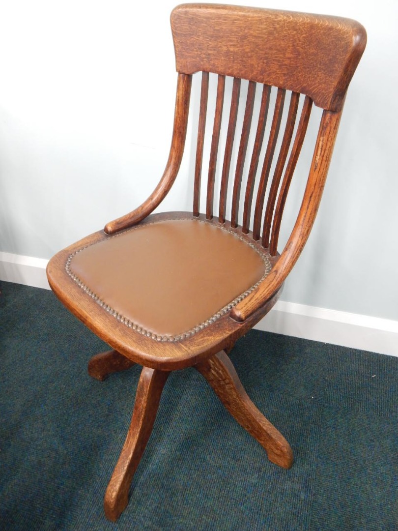 Appraisal: An early thC oak office chair stamped to plaque Curtis