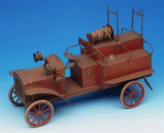 Appraisal: AN EARLY TH CENTURY TIN CLOCKWORK FIRE ENGINE with spoked