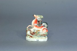 Appraisal: A Staffordshire figure of a stag being attacked by a