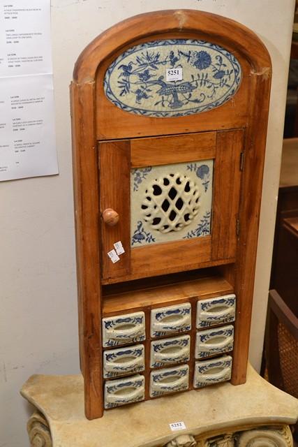 Appraisal: A DUTCH STYLE SPICE CABINET WITH DELFT TILES