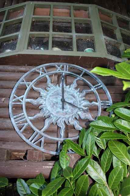 Appraisal: A BRONZED CLOCK FACE with sunburst decoration diameter