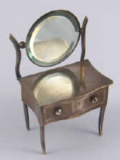 Appraisal: A silver miniature dressing table ring box with pivoting mirror