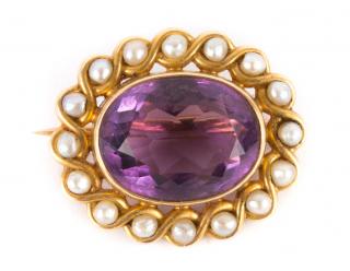 Appraisal: K oval amethyst set horizontally in bezel and surrounded by