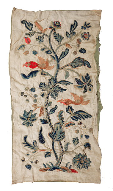 Appraisal: A SMALL CREWEL WORK PANEL ON LINEN depicting birds amongst