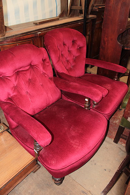 Appraisal: A VICTORIAN OAK OPEN LIBRARY ARMCHAIR with shaped button back