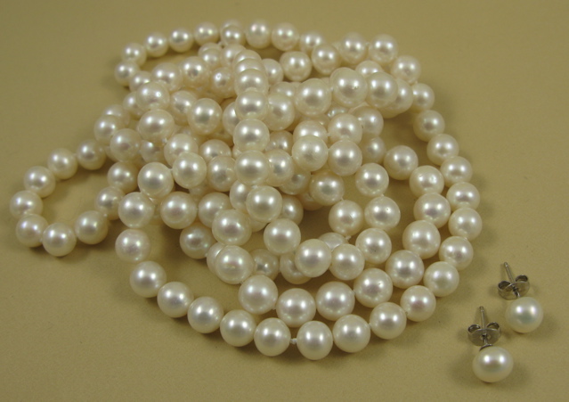 Appraisal: THREE ARTICLES OF PEARLS JEWELRY including a pair of earrings