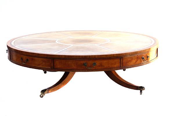 Appraisal: A George III style crossbanded satinwood drum table reduced in