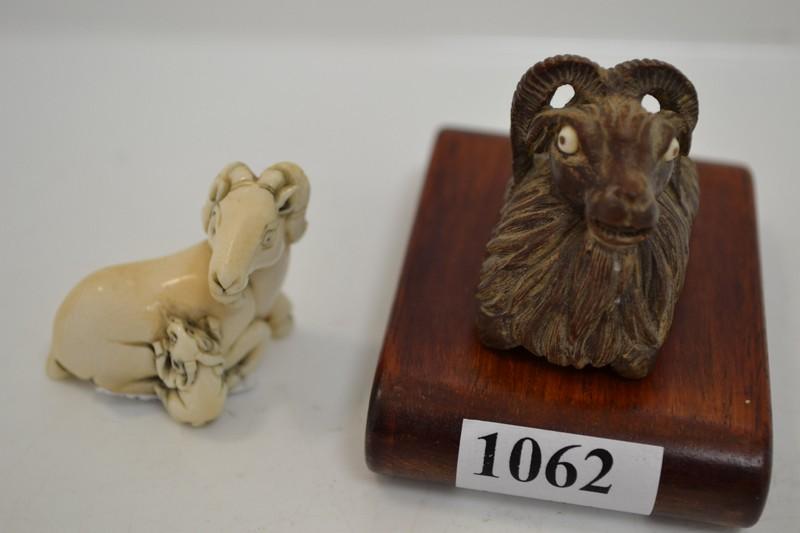 Appraisal: AN IVORY NETSUKE AND TIMBER CARVING ON STAND BOTH OF