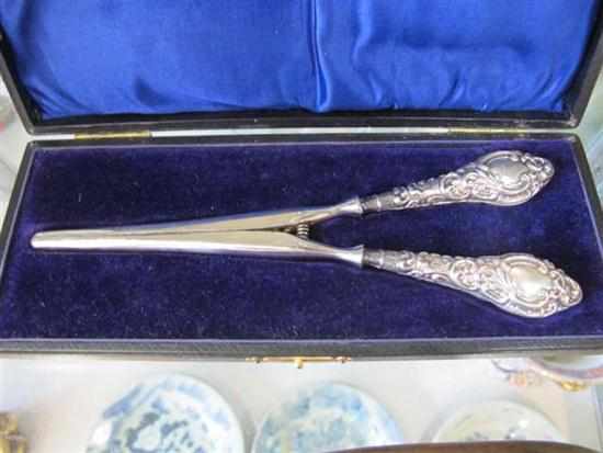 Appraisal: BOXED PAIR OF STERLING SILVER HANDLED GLOVE EXPANDERS