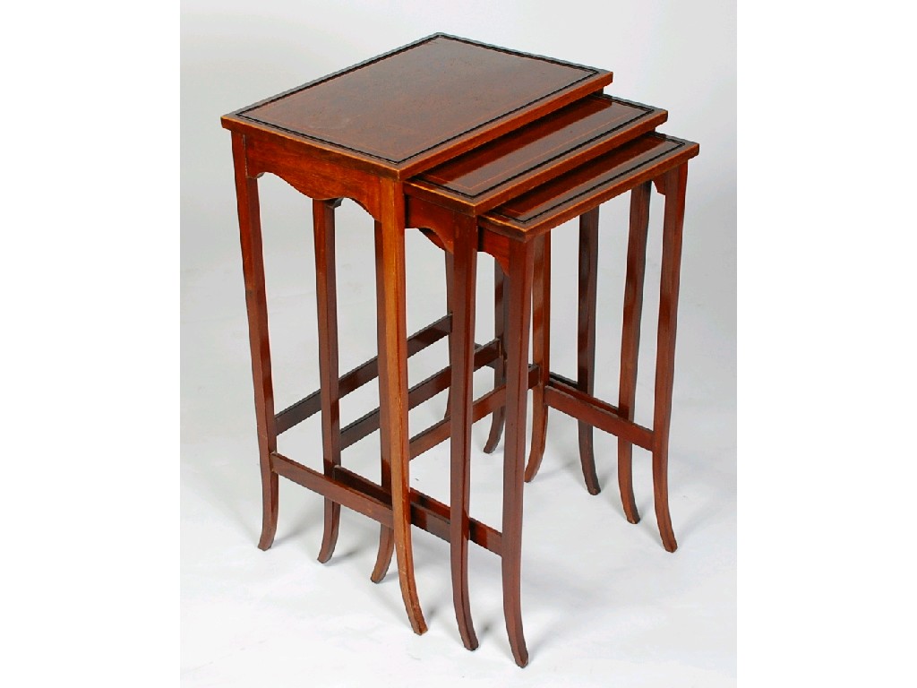 Appraisal: NEST OF THREE BOXWOOD STRUNG MAHOGANY OCCASIONAL TABLES the rectangular