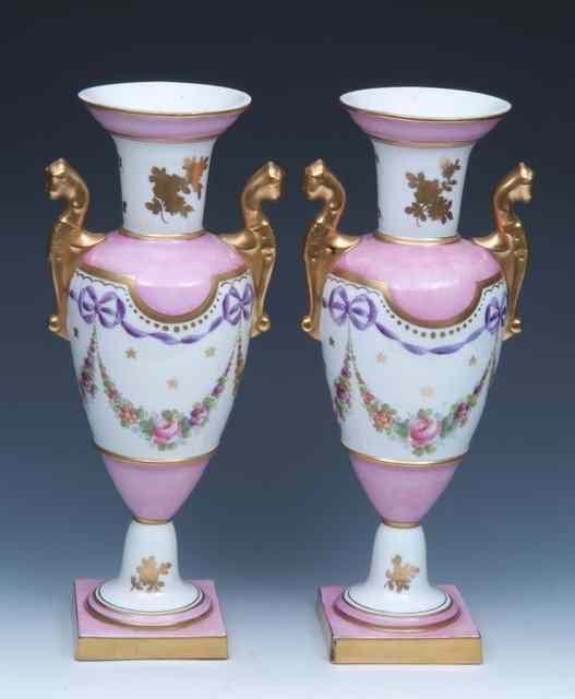 Appraisal: A PAIR OF CONTINENTAL PORCELAIN PINK GROUND VASES of baluster