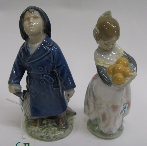 Appraisal: TWO GLAZED PORCELAIN CHILD FIGURES One a schoolboy figure blue