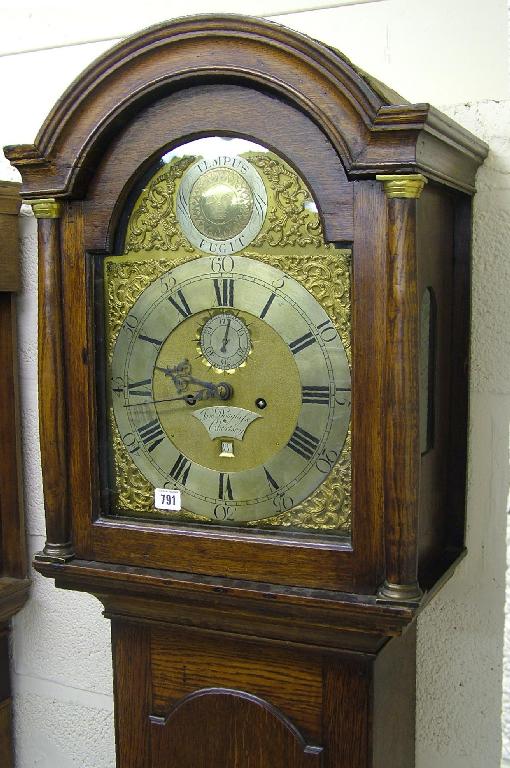 Appraisal: Oak eight day longcase clock the arched brass dial signed