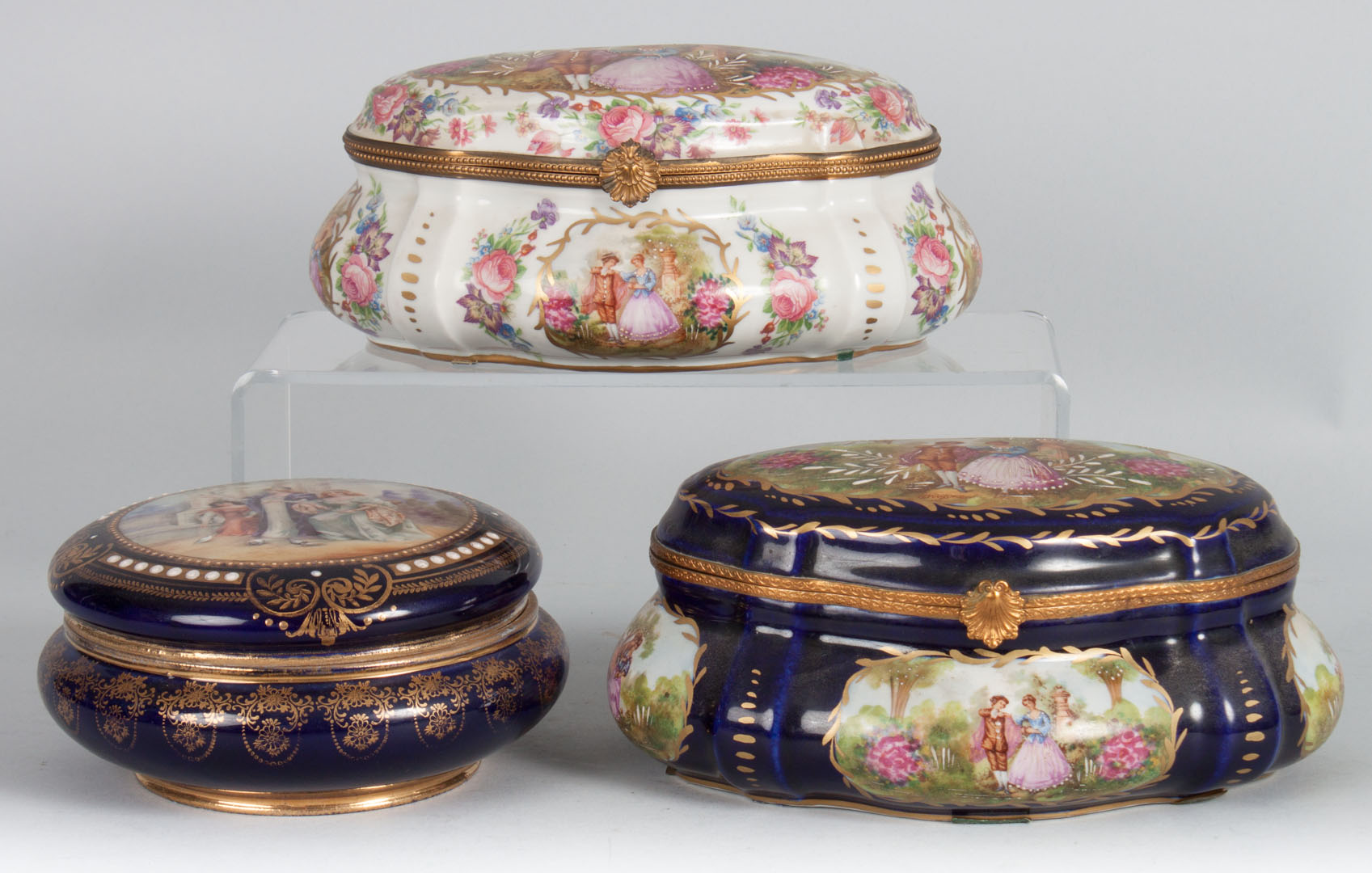 Appraisal: Two porcelain dresser boxes and powder box two Sevres style