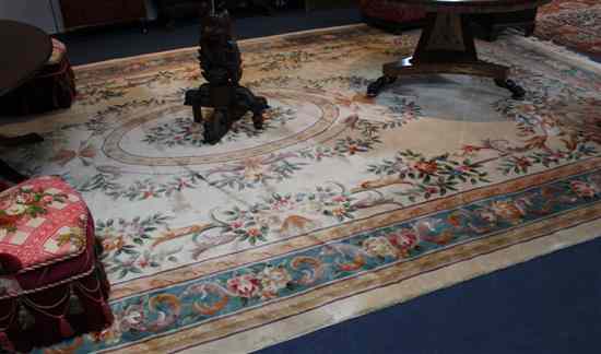 Appraisal: A Chinese ivory ground carpet decorated with oval floral panels