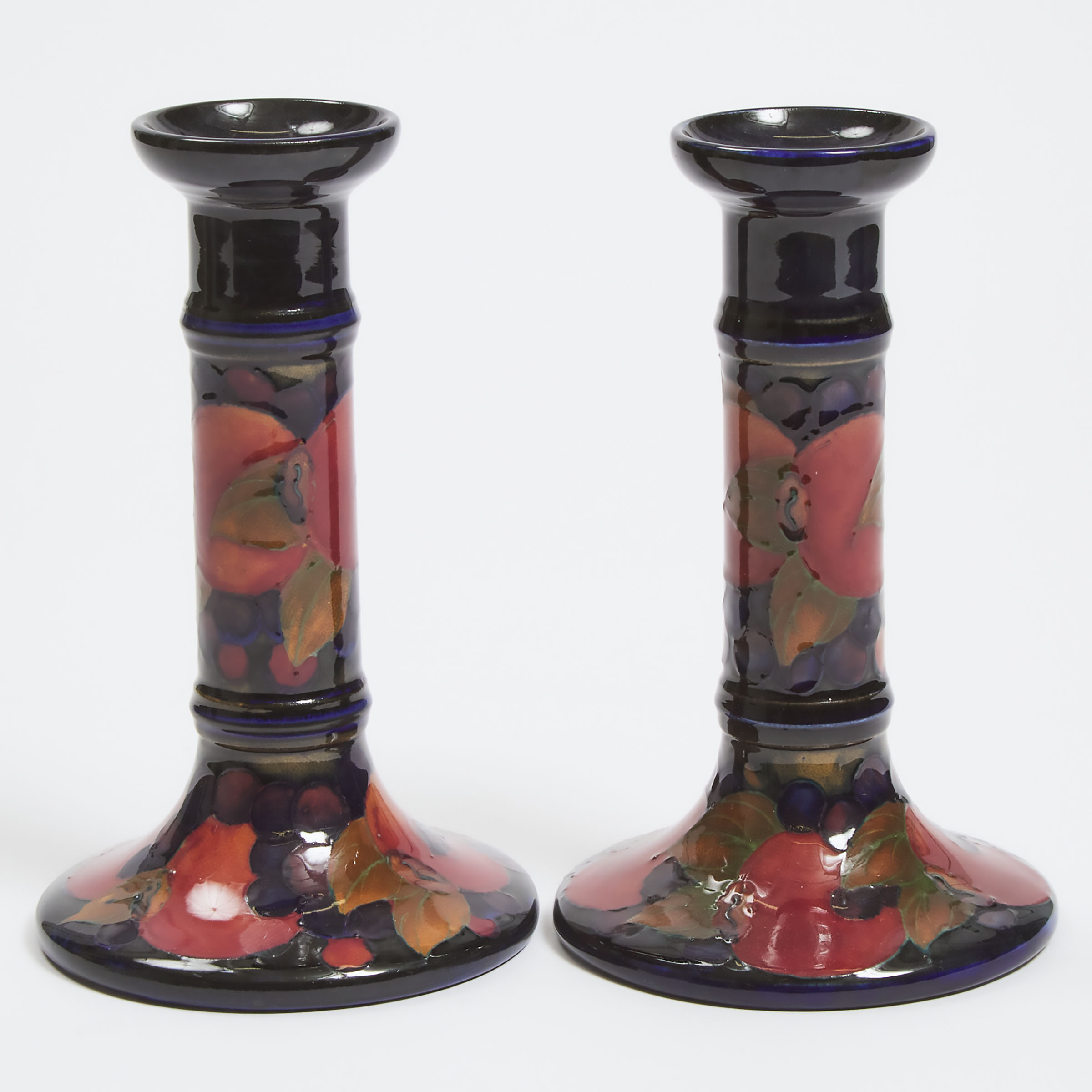 Appraisal: Pair of Moorcroft Pomegranate Table Candlesticks c height in cm