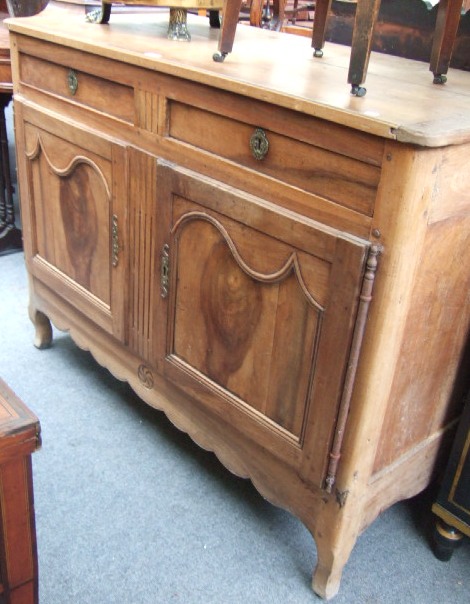 Appraisal: An early th century walnut buffet the rectangular top over