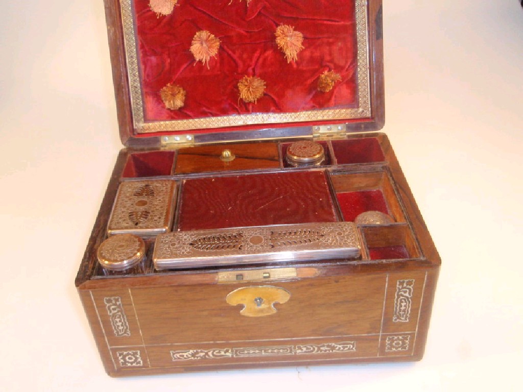 Appraisal: A Victorian rosewood travelling case with mother-of-pearl inlay fitted interior