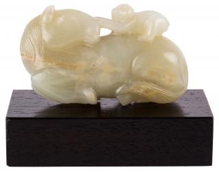 Appraisal: A PALE CELADON JADE OF A RECUMBENT HORSE WITH MONKEY