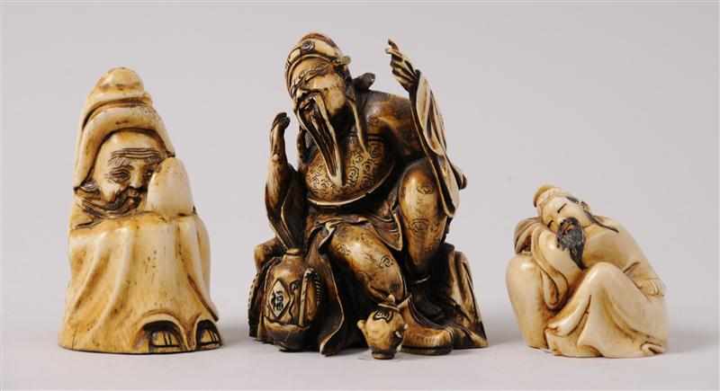 Appraisal: THREE CHINESE CARVED AND STAINED IVORY SEATED FIGURES Each signed