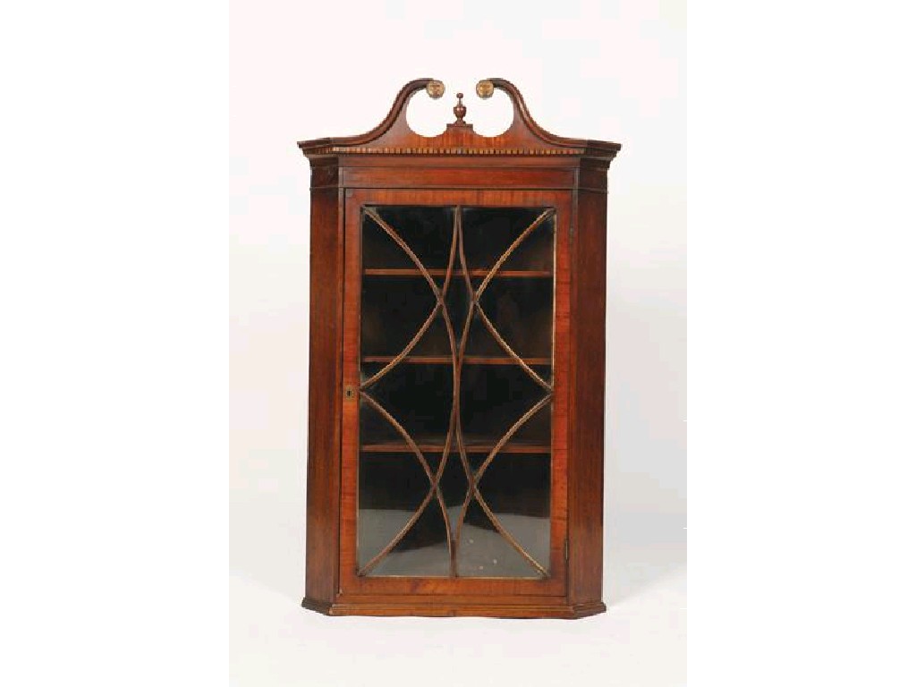 Appraisal: A GEORGE III MAHOGANY HANGING CORNER CUPBOARD with a swan