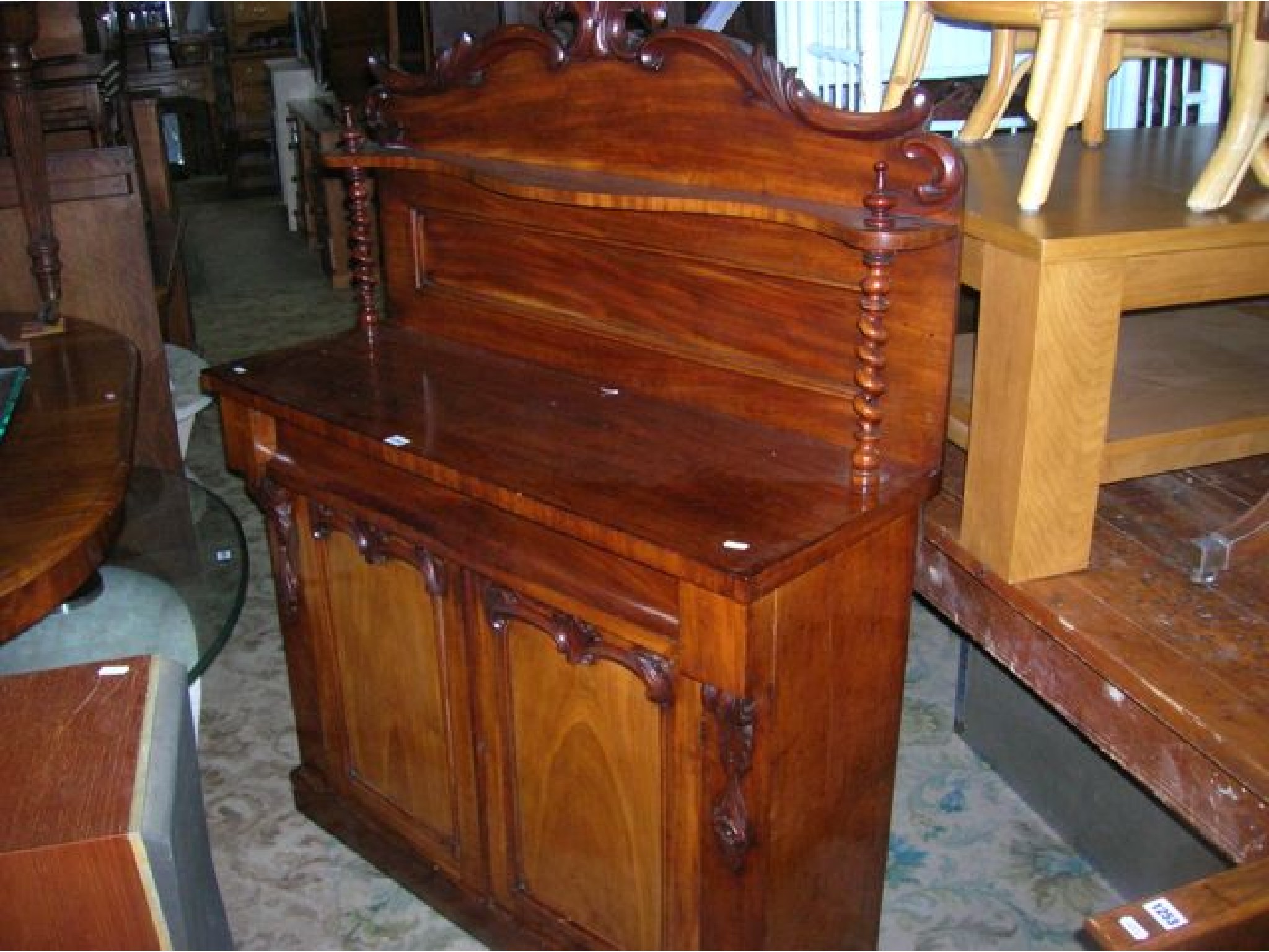 Appraisal: A Victorian mahogany chiffonier the raised panelled back with scrolling