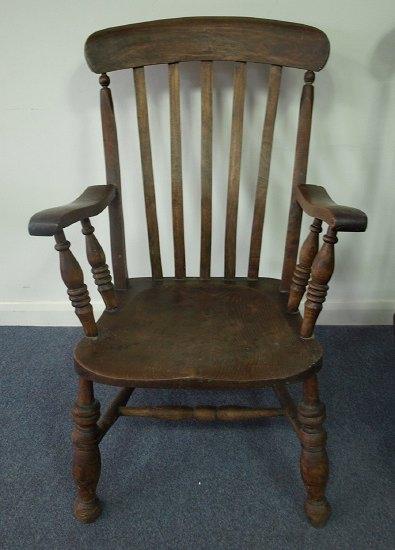 Appraisal: A Windsor style chair the rail back and open arms