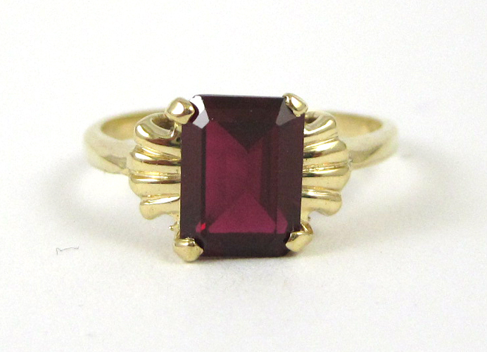 Appraisal: SYNTHETIC RUBY AND FOURTEEN KARAT GOLD RING set with a