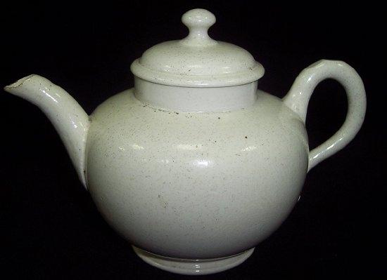 Appraisal: A Staffordshire salt glaze teapot and cover circa with notched