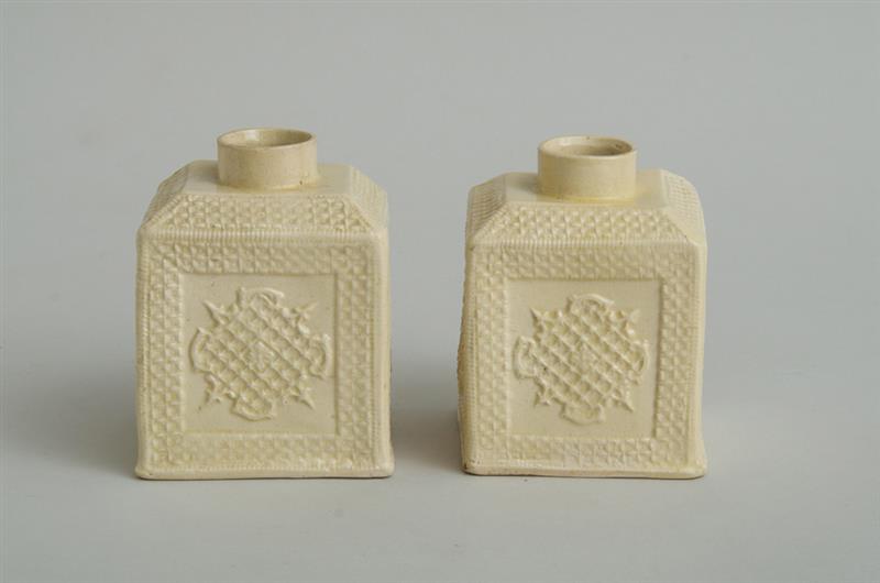 Appraisal: PAIR OF ENGLISH SALT-GLAZED CREAMWARE TEA CADDIES Of block-form modeled