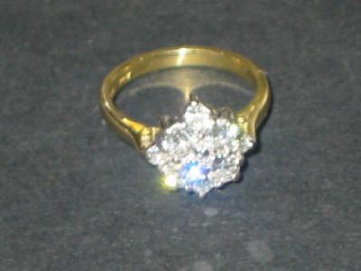 Appraisal: A DIAMOND CLUSTER RING of squared form set with four